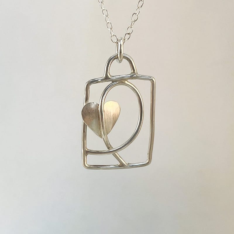 Sterling Silver Necklace. Handmade abstract leaf on a swirling vine. Hung on a silver chain